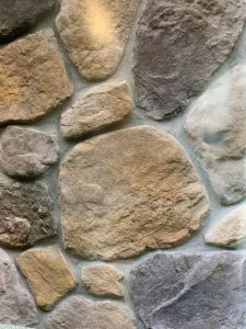 Close-up of cultured stone veneer with natural fieldstone pattern in East Brunswick, NJ by CMB Stucco